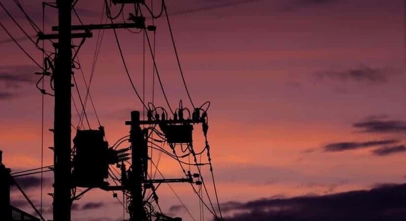 Silhouette of power lines and transformers