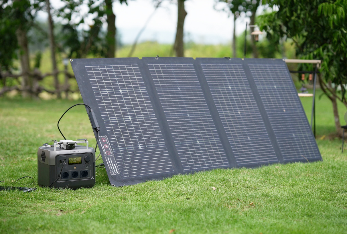 A solar panel connected to a RIVER 2 Max portable power station or solar battery.